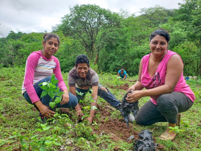 Juan Ramon Flores Casco and family out in the fields.
